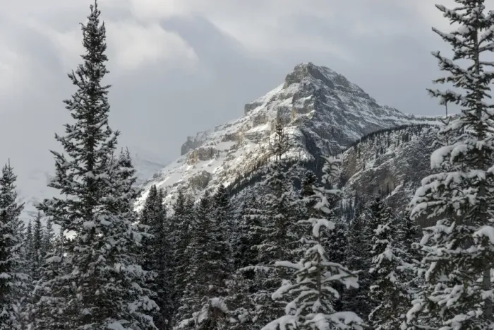 Framed Print : Rugged mountain peak with snow under a cloudy sky Framed Print : Rugged mountain peak with snow under a cloudy sky