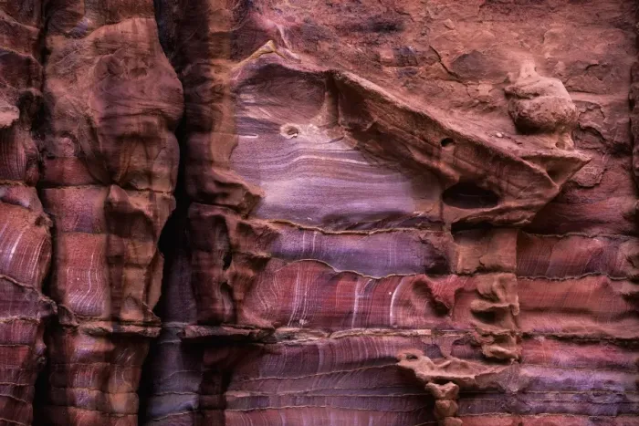Framed Print : A rugged rock wall of colourful sandstone