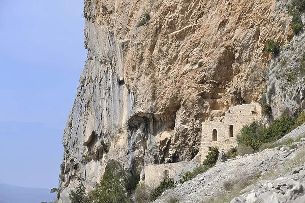 Ruins of a monastery built into the rock at the Botanical Garden of Kotisina, Makaraska, Croatia, Europe