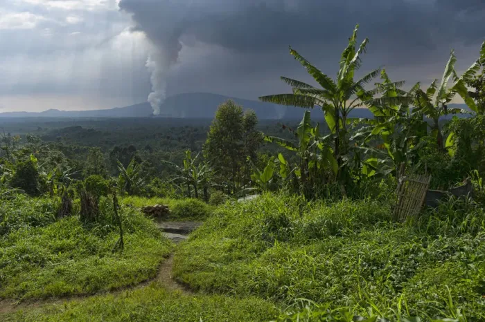 Framed Print : Rural dwelling with erupting Nyamuragira Volcano in background, Virunga National Park, Parq National des Virunga, Democratic Republic of Congo Framed Print : Rural dwelling with erupting Nyamuragira Volcano in background, Virunga National Park, Parq National des Virunga, Democratic Republic of Congo