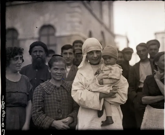 Framed Print : Russian Nurse Smiles As She Holds Child Framed Print : Russian Nurse Smiles As She Holds Child