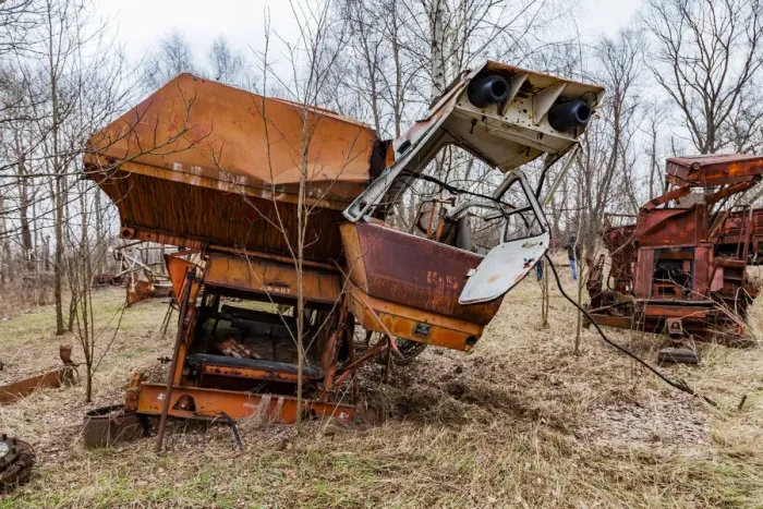 Framed Print : Rusty harvesters in an abandoned farm. Chernobyl zone, Ukraine