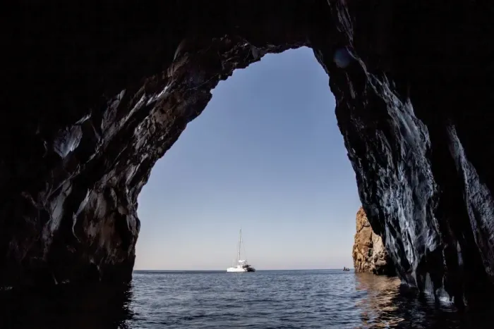 Framed Print : Sailboat viewed from cave in ocean Framed Print : Sailboat viewed from cave in ocean