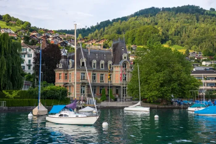 Framed Print : Sailing boats and village beside lake Thun Framed Print : Sailing boats and village beside lake Thun