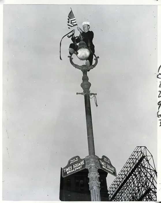 Framed Print : Sailor On Light Post With Flag Framed Print : Sailor On Light Post With Flag