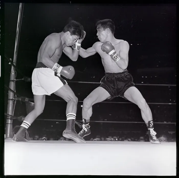 Framed Print : Saldivar Blocks Punch From Japanese Boxer