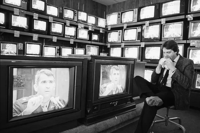 Framed Print : Salesman Eats, Watches Oliver North On Tv Framed Print : Salesman Eats, Watches Oliver North On Tv