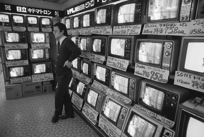 Framed Print : Salesman Stands Idly In Front Of Tv Sets Framed Print : Salesman Stands Idly In Front Of Tv Sets