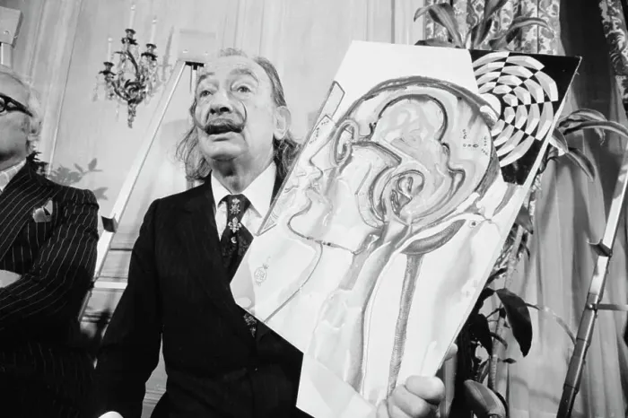 Framed Print : Salvador Dali Posing with Painting Framed Print : Salvador Dali Posing with Painting