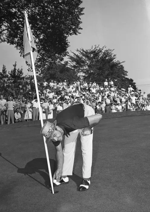 Framed Print : Sam Snead Bending Down to Retrieve Ball from Hole Framed Print : Sam Snead Bending Down to Retrieve Ball from Hole