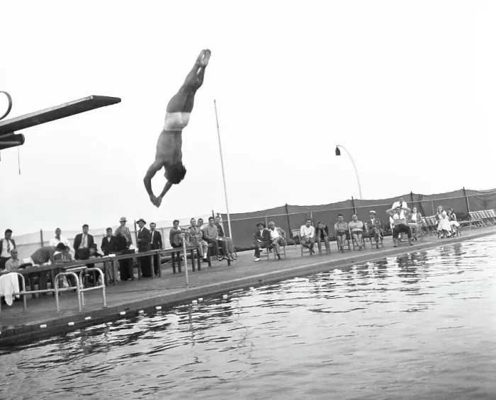 Framed Print : Sammy Lee, displays the form that won him the three meter diving event Framed Print : Sammy Lee, displays the form that won him the three meter diving event