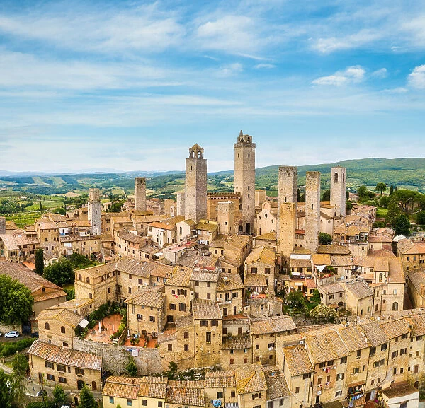 San Gimignano from above, aerial view from town to country. Tuscany, Italy