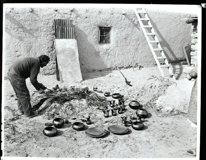 Framed Print : San Ildefonso Indian Examining Pottery Framed Print : San Ildefonso Indian Examining Pottery