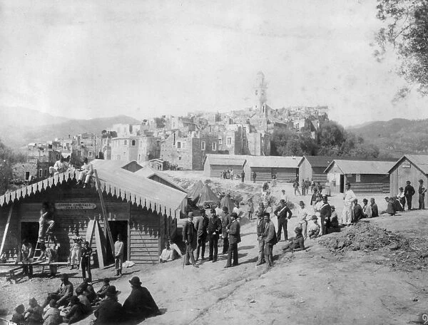 San Remo. 1886: A group of men outside a group of temporary huts built