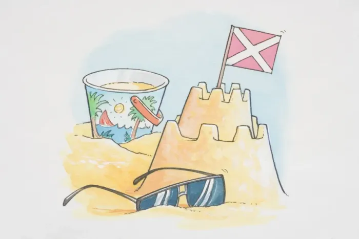 Framed Print : Sand castle with flag, bucket and pair of sunglasses Framed Print : Sand castle with flag, bucket and pair of sunglasses