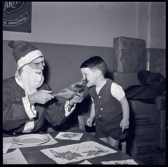 Framed Print : Santa and Boy Eating Turkey Leg