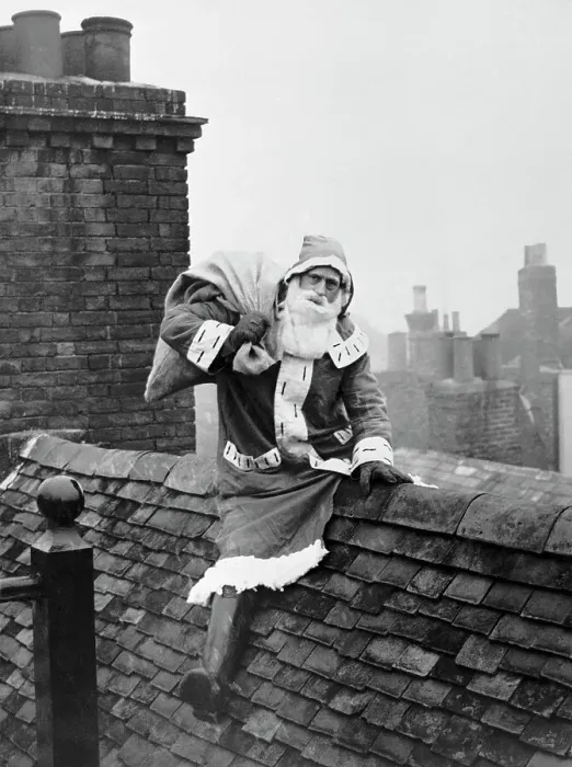 Framed Print : Santa Claus Seated on Rooftop