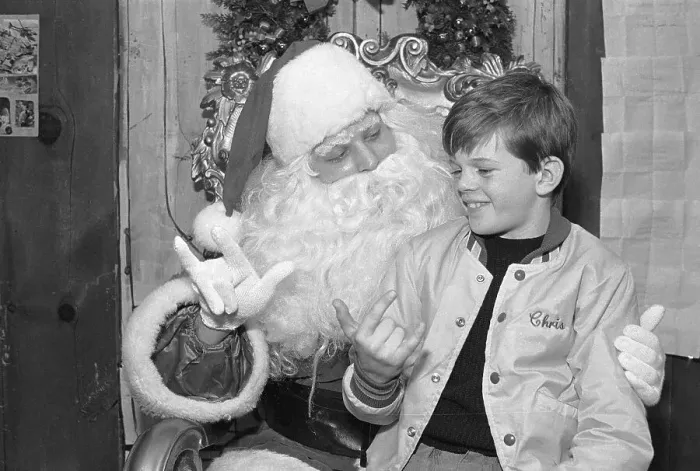 Framed Print : Santa Claus Signing to Deaf Child Framed Print : Santa Claus Signing to Deaf Child