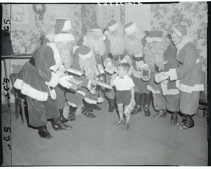Framed Print : Santa Clauses Offering Presents to Anthony Ventura Framed Print : Santa Clauses Offering Presents to Anthony Ventura
