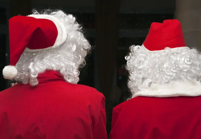 Framed Print : Two Santas, viewed from behind Framed Print : Two Santas, viewed from behind