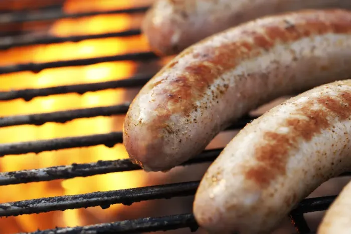 Framed Print : Sausages being grilled on a barbecue Framed Print : Sausages being grilled on a barbecue
