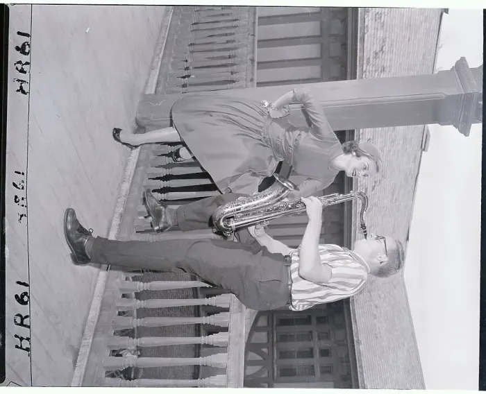 Framed Print : Saxophonist Playing to Model on Porch Framed Print : Saxophonist Playing to Model on Porch
