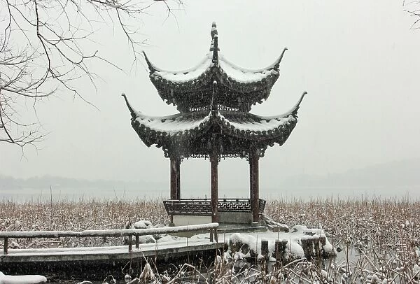 Scenic view of a pavilion by the West Lake in snow, Hangzhou, China