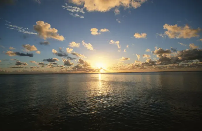 Framed Print : Scenic View of the Sun Setting over the Calm Ocean Framed Print : Scenic View of the Sun Setting over the Calm Ocean