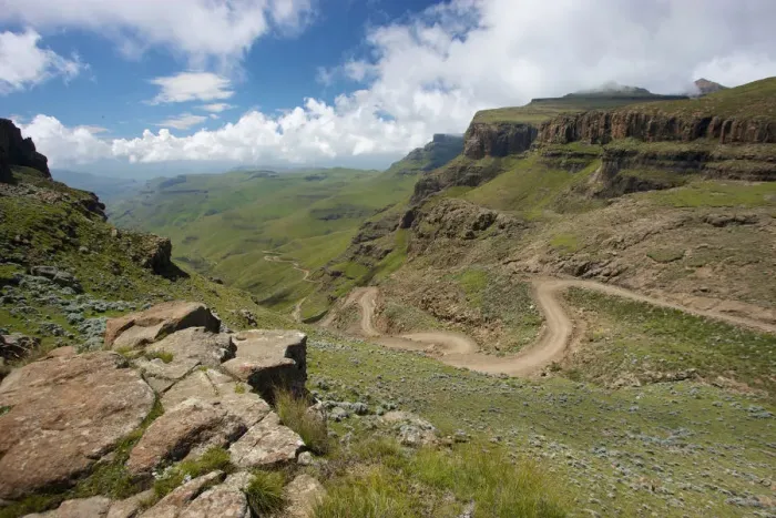 Framed Print : A scenic view of the a trail through the hills of the Sani Pass, Drakensberg Park, KwaZulu-Natal, South Africa