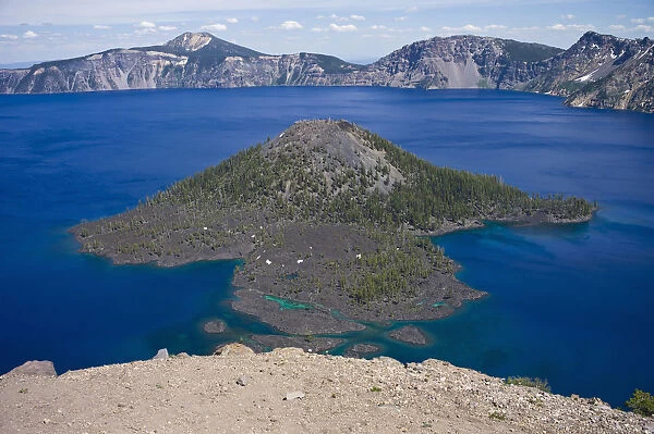 Scenic view of Wizard Island, a volcanic cinder cone, in Crater Lake, Crater Lake National Park, Oregon, USA