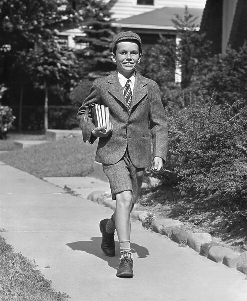 Schoolboy on sidewalk