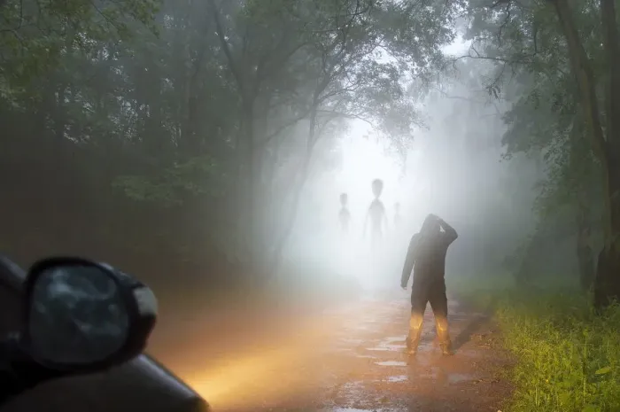 Framed Print : A science fiction concept of a man looking at aliens coming out the mist on a foggy Framed Print : A science fiction concept of a man looking at aliens coming out the mist on a foggy