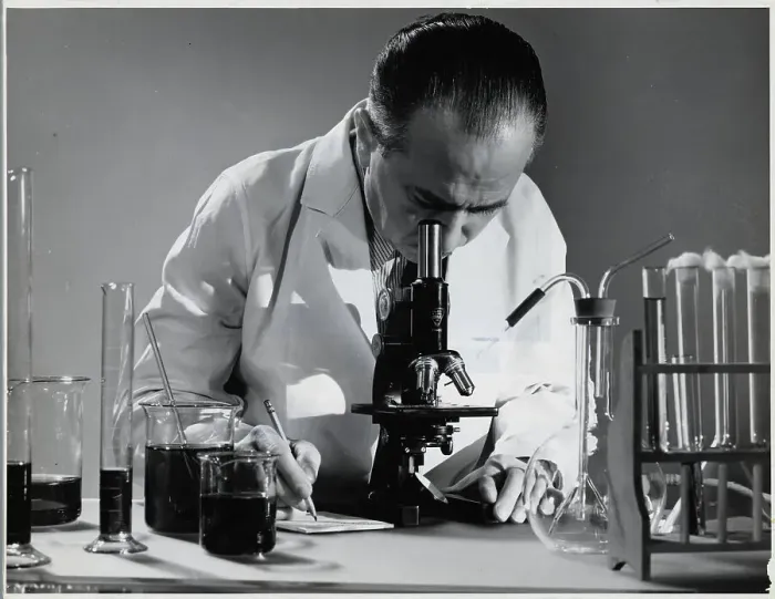 Framed Print : Scientist Peers into Microscope Framed Print : Scientist Peers into Microscope