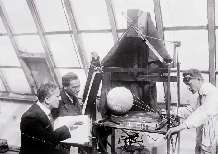 Framed Print : Scientists Making Film Tests of Globe Framed Print : Scientists Making Film Tests of Globe