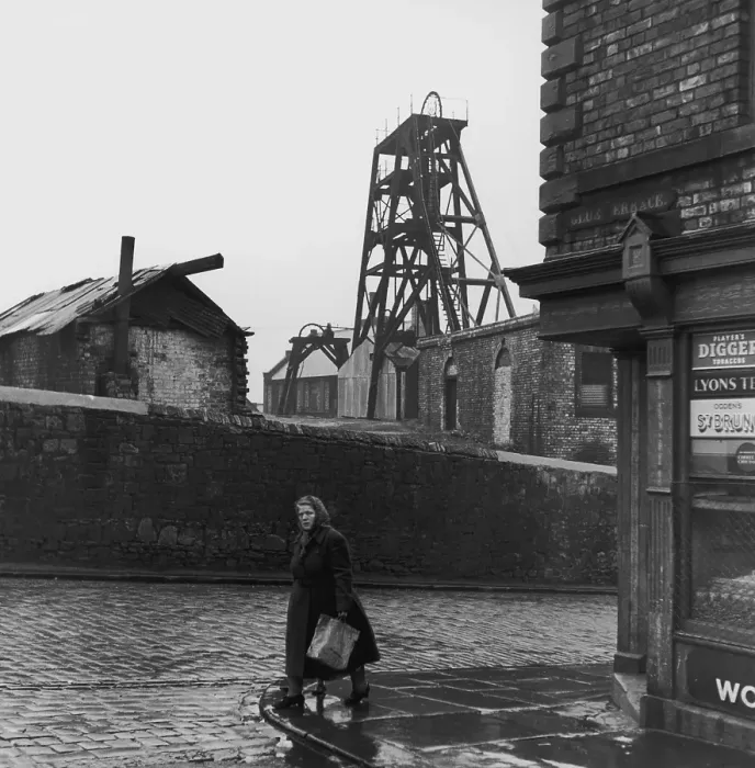 Framed Print : Scotswood. A woman passes Glue Terrace in Scotswood Framed Print : Scotswood. A woman passes Glue Terrace in Scotswood