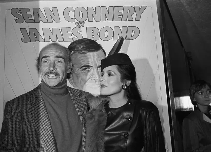 Framed Print : Sean Connery and Barbara Carrera in Front of Poster Framed Print : Sean Connery and Barbara Carrera in Front of Poster