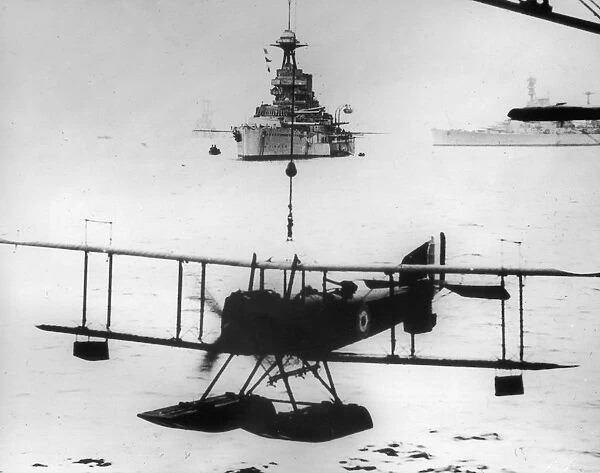 Seaplane. circa 1916: A Fairey F17 Campania seaplane is lowered onto the water