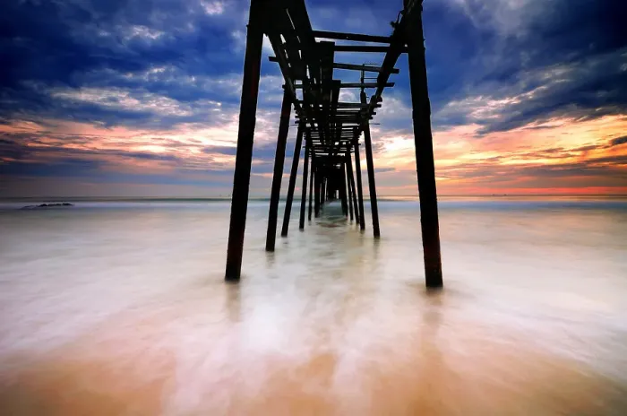 Framed Print : Seascape with old broken pier against dramatic sky Framed Print : Seascape with old broken pier against dramatic sky