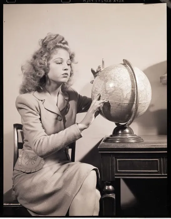 Framed Print : Seated Woman Spinning Globe