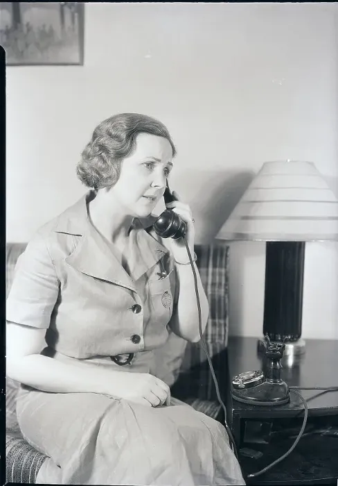 Framed Print : Seated Woman Using Telephone Framed Print : Seated Woman Using Telephone