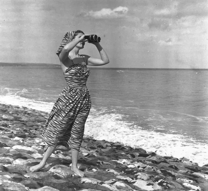 Framed Print : A Seaview. 24th July 1948: A woman looking out to sea with binoculars Framed Print : A Seaview. 24th July 1948: A woman looking out to sea with binoculars