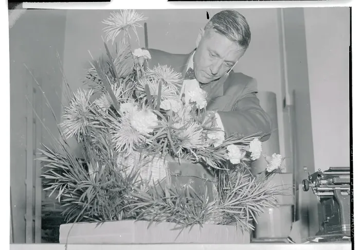 Framed Print : Secret Service Agent Checking a Plant Framed Print : Secret Service Agent Checking a Plant