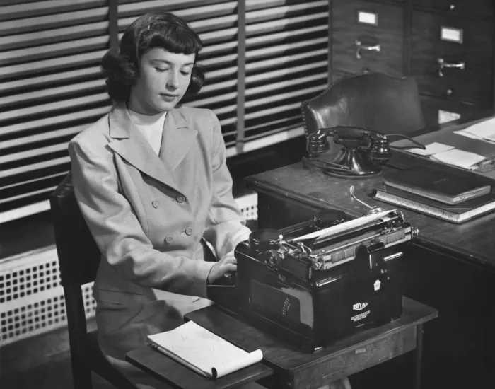 Framed Print : Secretary typing in office, (B&W) Framed Print : Secretary typing in office, (B&W)