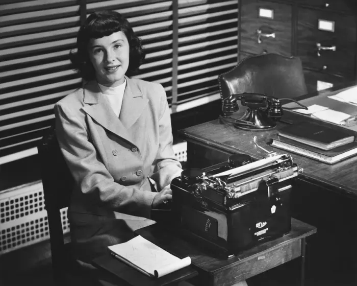 Framed Print : Secretary typing in office, (B&W) Framed Print : Secretary typing in office, (B&W)