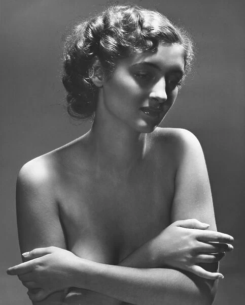 Semi naked woman posing in studio, (B&W), portrait