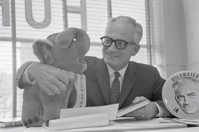 Framed Print : Senator Barry Goldwater Cuddling a Stuffed Elephant Framed Print : Senator Barry Goldwater Cuddling a Stuffed Elephant
