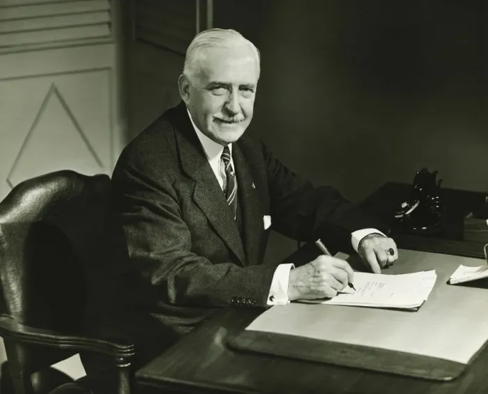 Framed Print : Senior businessman signing documents at desk, (B&W), portrait Framed Print : Senior businessman signing documents at desk, (B&W), portrait