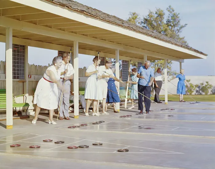 Framed Print : Senior people playing shuffleboard Framed Print : Senior people playing shuffleboard