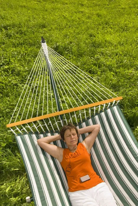 Framed Print : Senior woman listening to music in a hammock Framed Print : Senior woman listening to music in a hammock