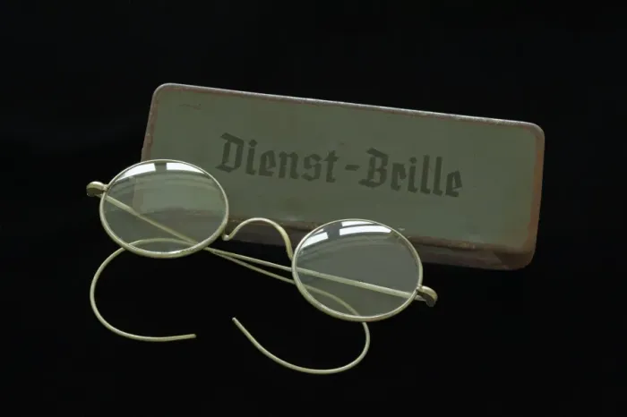 Framed Print : Service glasses from 1938 with a sheet metal case on black Framed Print : Service glasses from 1938 with a sheet metal case on black